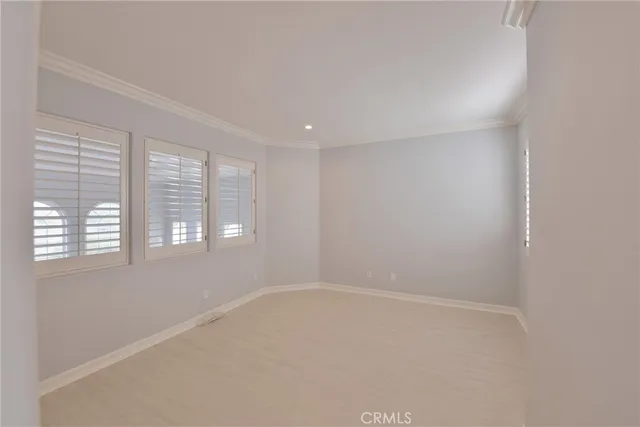 a bathroom with a glass shower door and a mirror