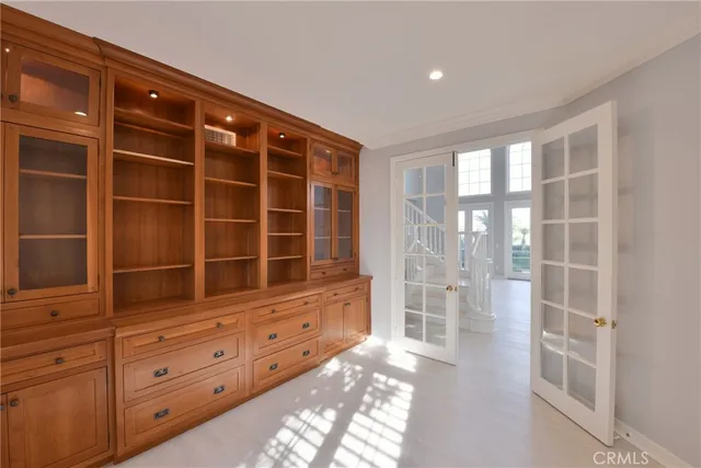 a view of wooden floor and windows in a room