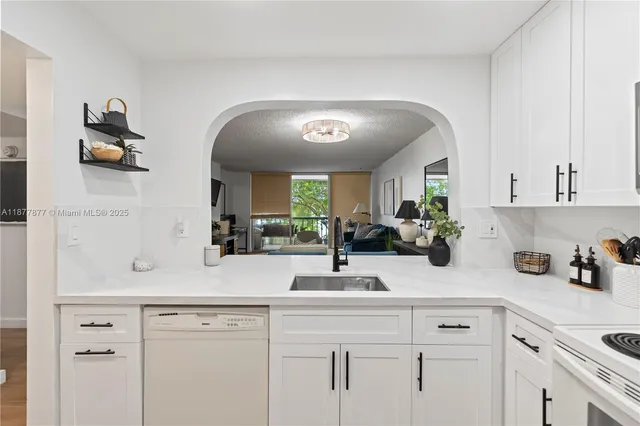 a kitchen with a sink and cabinets