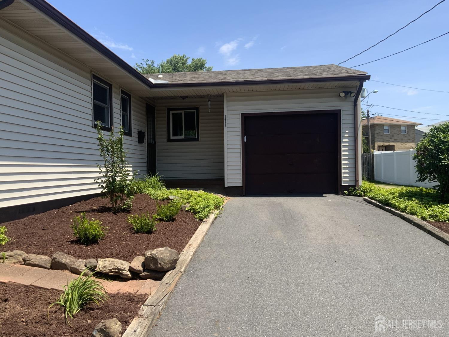 178 Willow Street Port Reading, NJ 07064 - Photo 2 of 15 a front view of a house with a yard