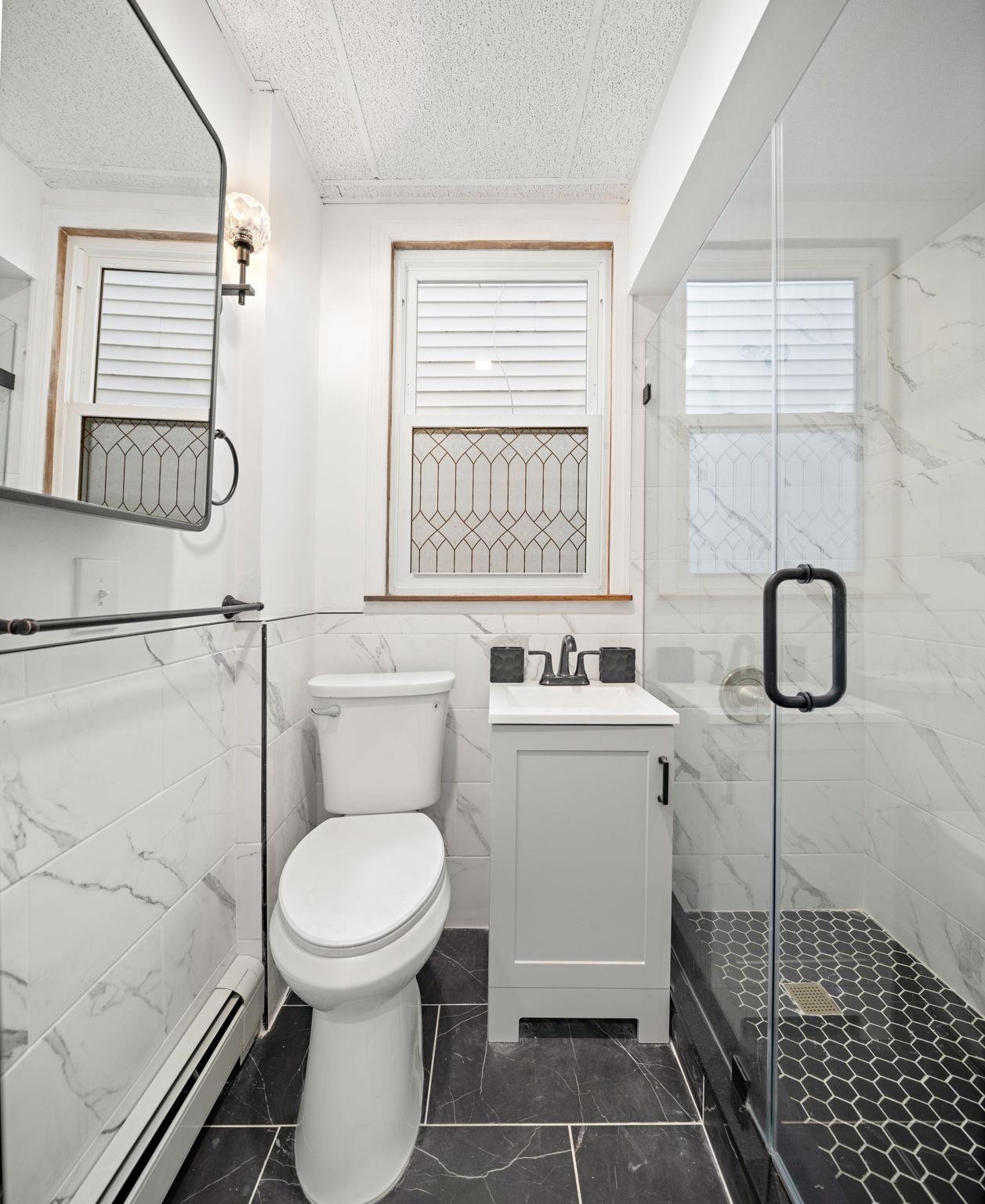 379 Union Street, Unit 2 Jersey City, NJ 07304 - Photo 11 of 20 a bathroom with a toilet and a shower