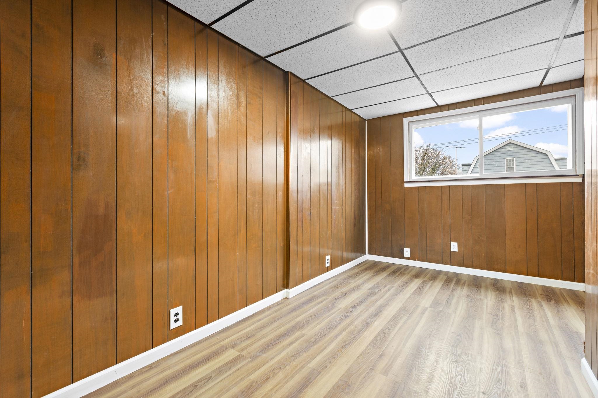 379 Union Street, Unit 2 Jersey City, NJ 07304 - Photo 20 of 20 a view of an empty room with painting on the wall and a window