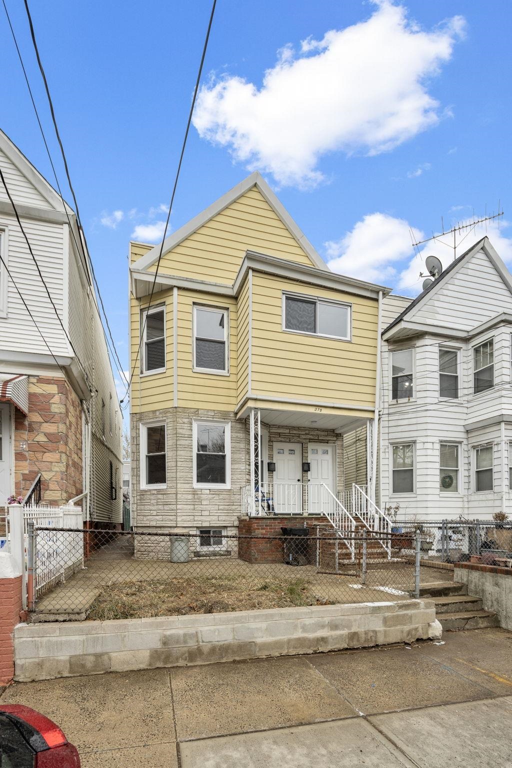 379 Union Street, Unit 2 Jersey City, NJ 07304 - Photo 8 of 20 a front view of a house with a yard