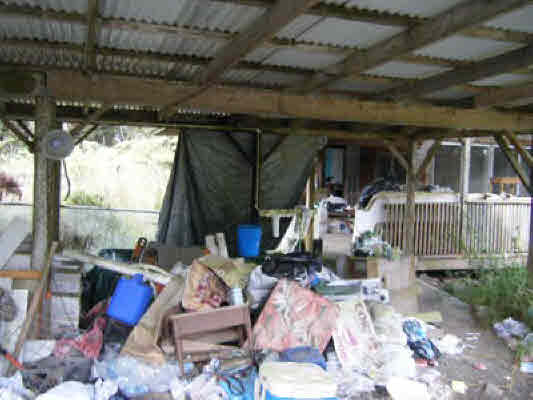 11-3012 Kahaualea Road Volcano, HI 96771 - Photo 4 of 7 a view of gym equipment and fire pit in patio