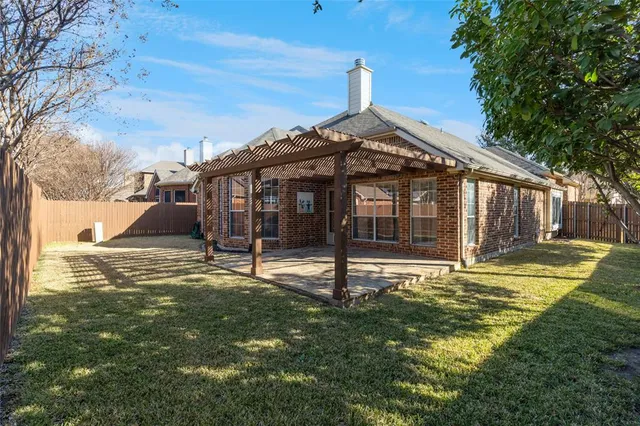 a view of a backyard of a house
