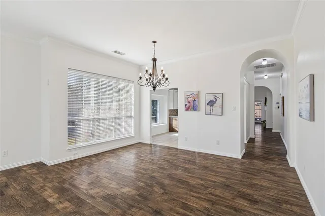 a view of empty room with furniture and a fireplace