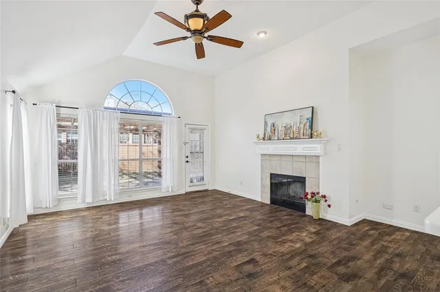 a view of an empty room and wooden floor