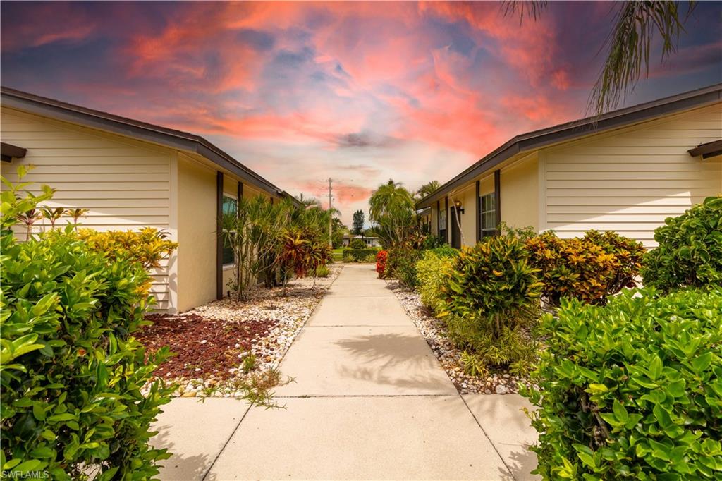 1014 Pine Isle Lane, Unit 1014 Naples, FL 34112 - Photo 2 of 20 a view of a pathway with a pathway