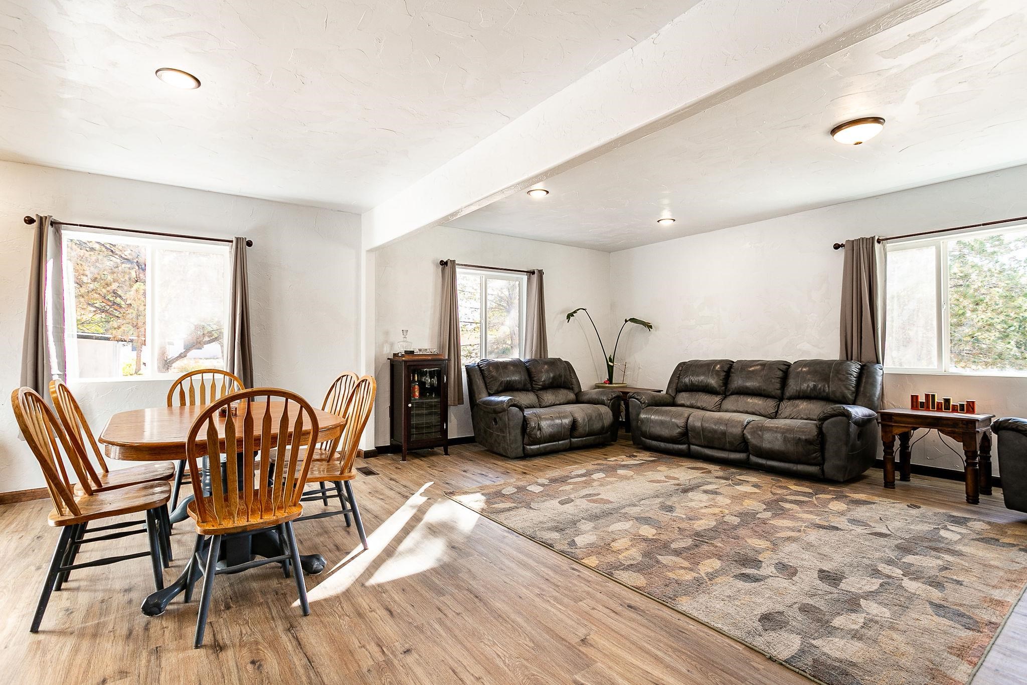 3612 G Road Palisade, CO 81526 - Photo 11 of 38 a living room with furniture wooden floor and a window