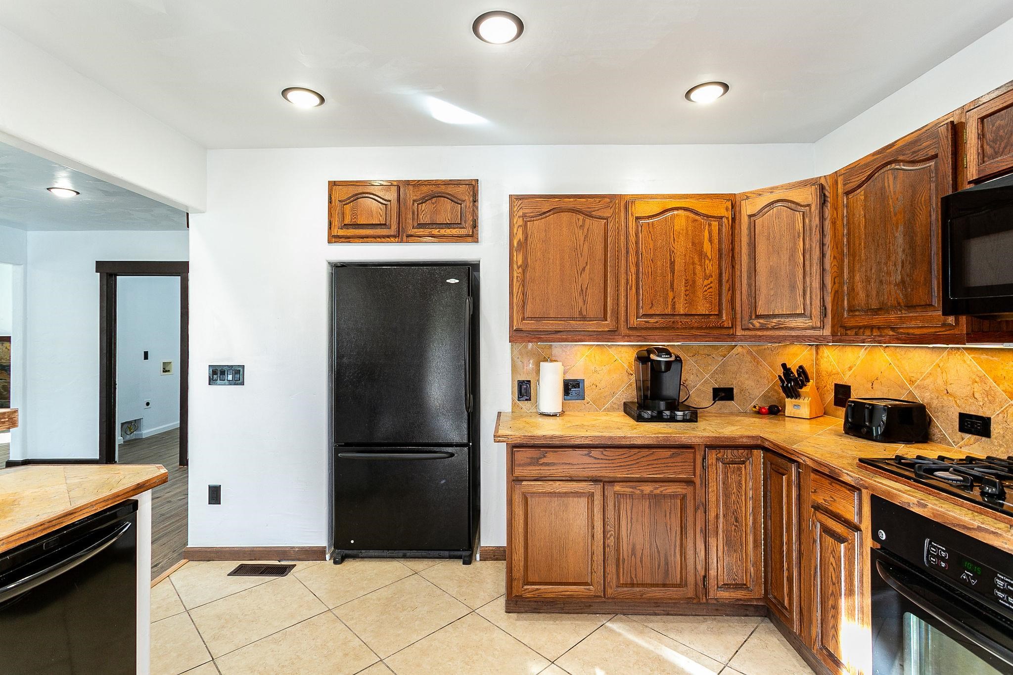 3612 G Road Palisade, CO 81526 - Photo 17 of 38 a kitchen with stainless steel appliances granite countertop a refrigerator and a sink