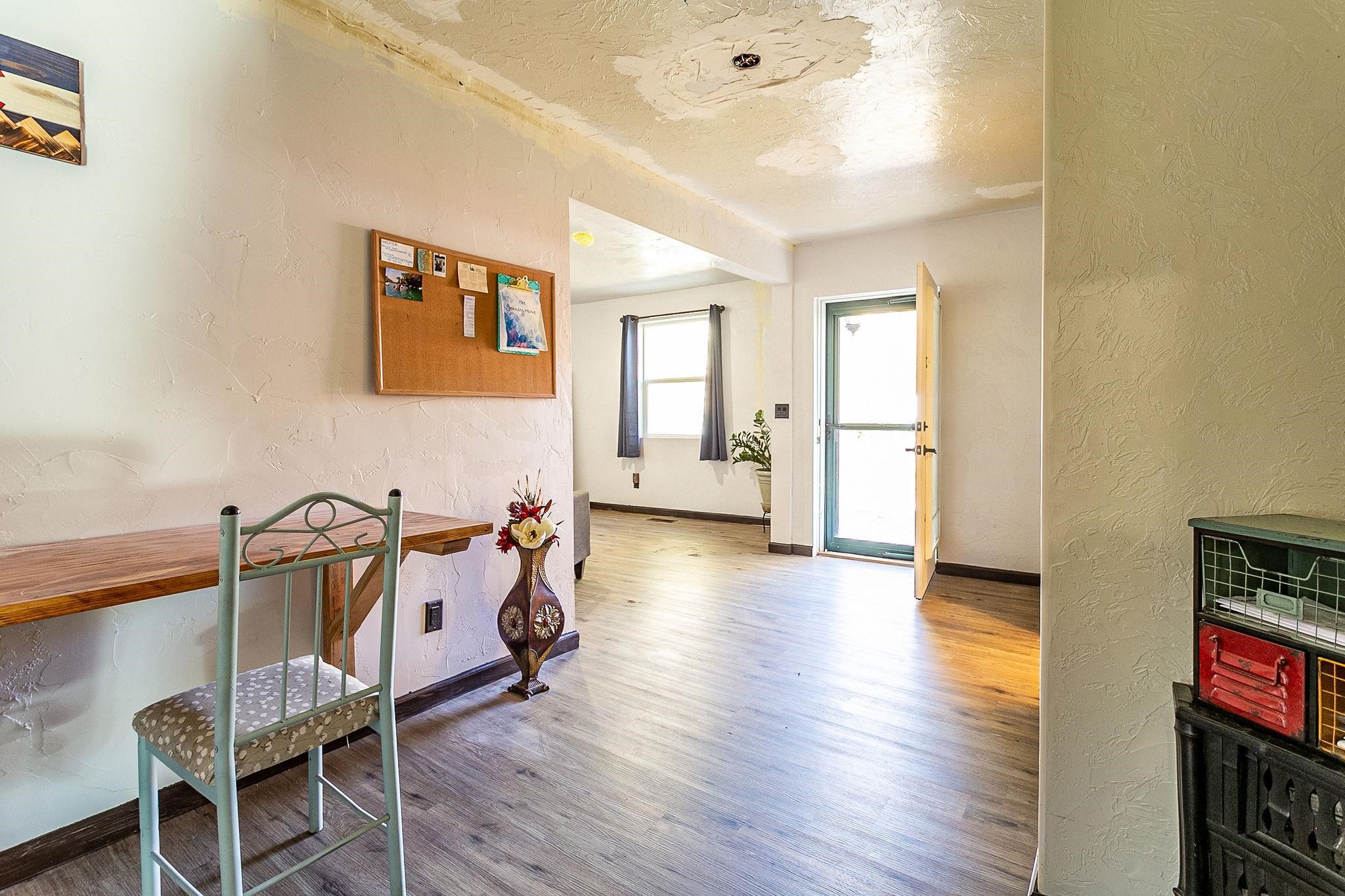3612 G Road Palisade, CO 81526 - Photo 23 of 38 a view of a room with wooden floor and furniture
