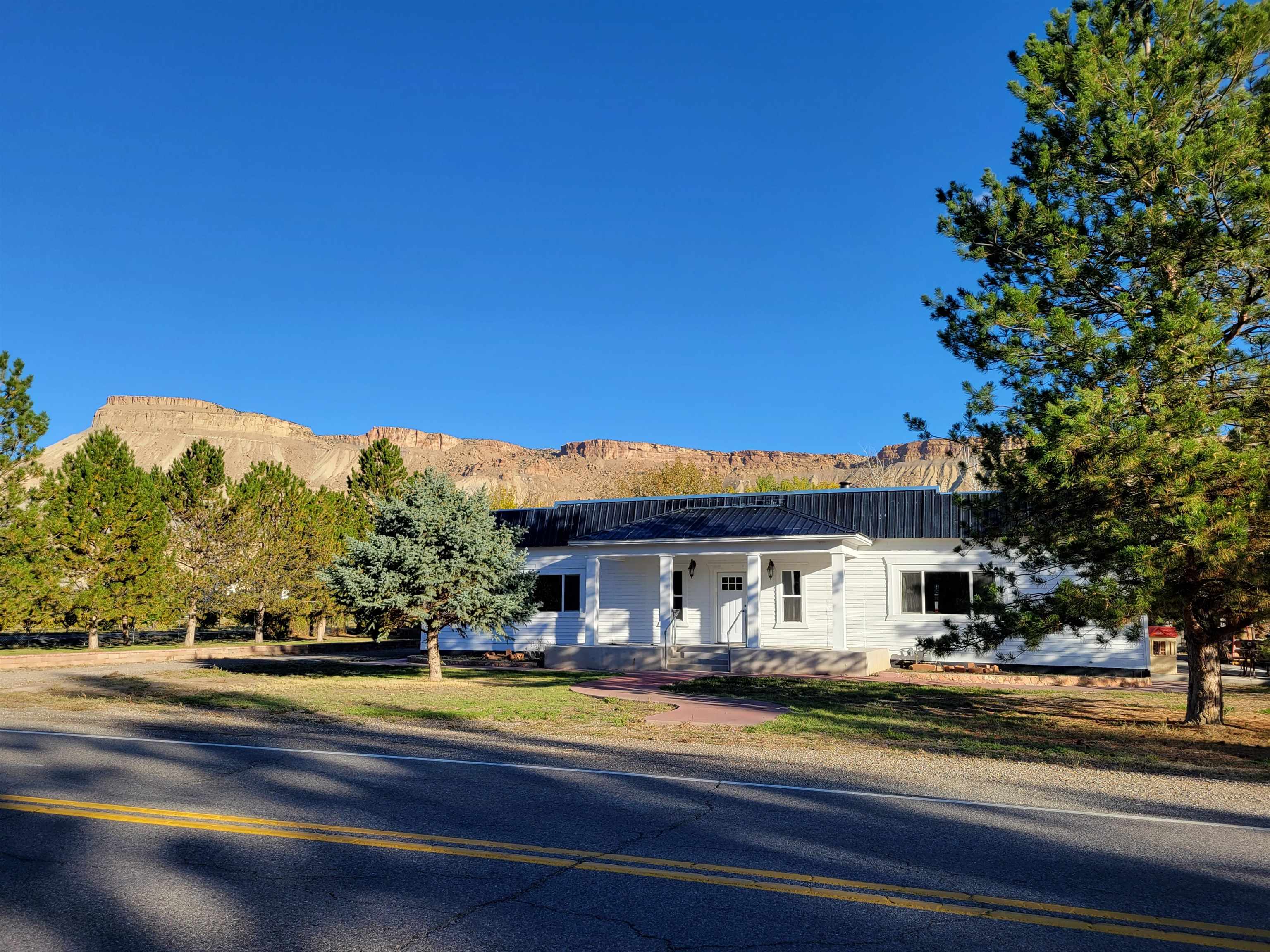 3612 G Road Palisade, CO 81526 - Photo 38 of 38 a view of a house with a swimming pool