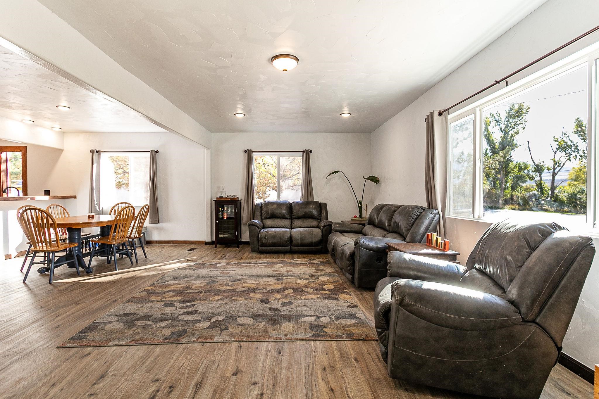 3612 G Road Palisade, CO 81526 - Photo 10 of 38 a living room with furniture and a large window
