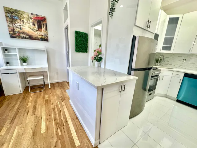 a view of kitchen with sink microwave and refrigerator