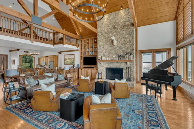 a living room with patio fireplace furniture and a fireplace