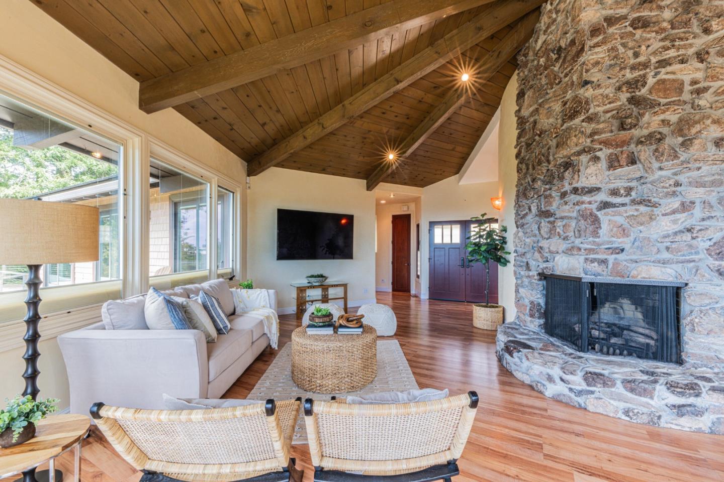 430 Quail Run Road Aptos, CA 95003 - Photo 18 of 34 a living room with furniture a flat screen tv and a fireplace