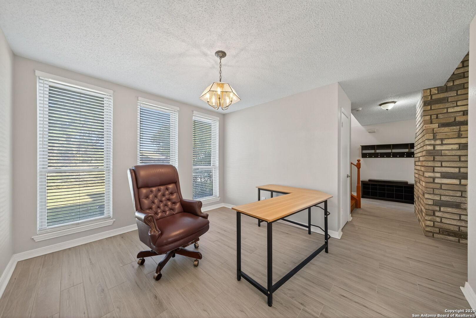 7515 Forest Edge Live Oak, TX 78233 - Photo 15 of 30 a view of a workspace with furniture and a window