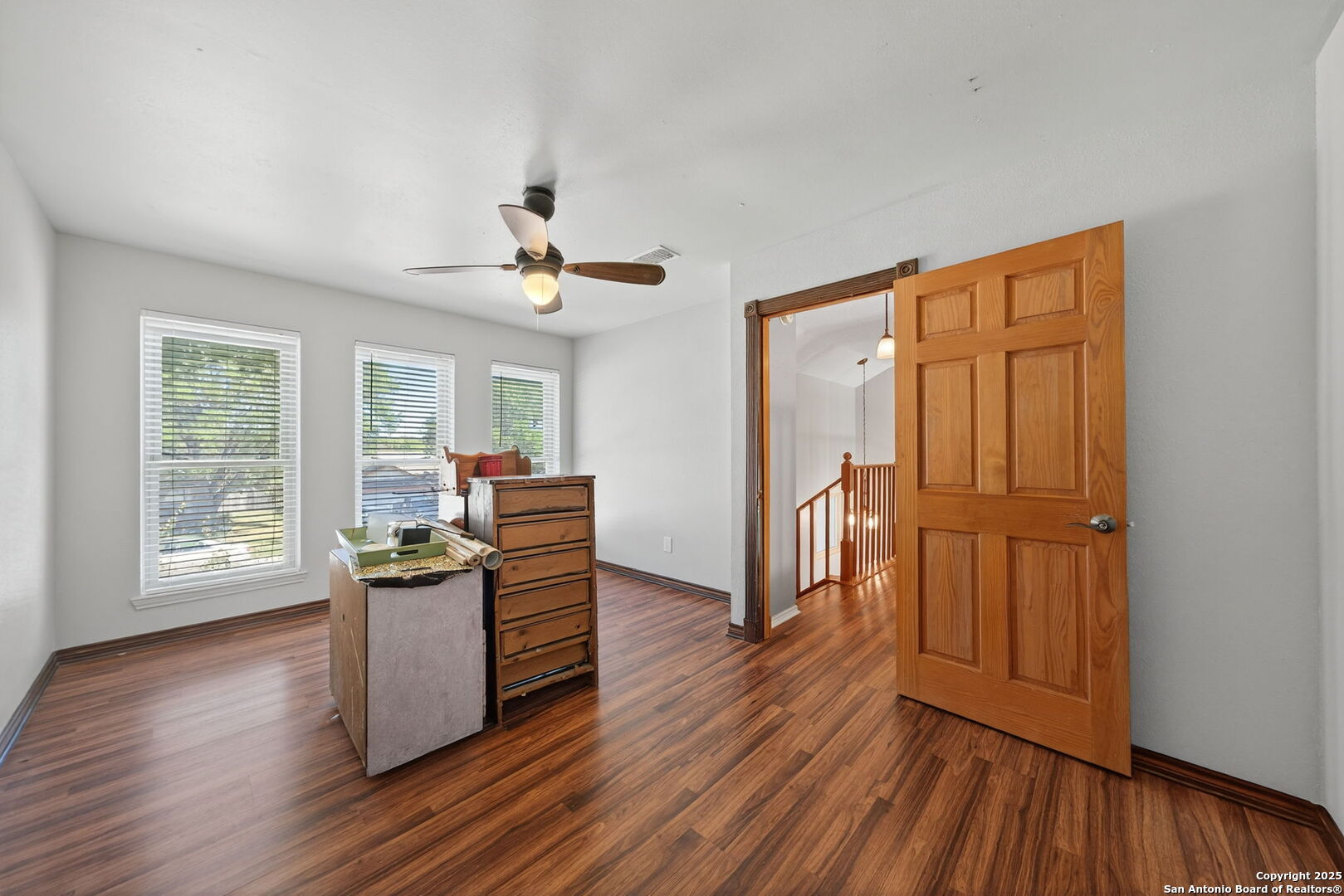 7515 Forest Edge Live Oak, TX 78233 - Photo 20 of 30 a living room with furniture and a wooden floor