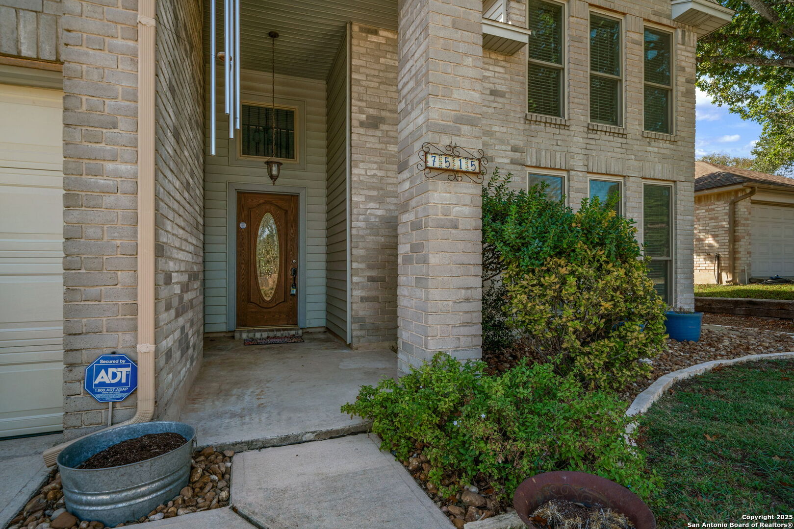 7515 Forest Edge Live Oak, TX 78233 - Photo 4 of 30 a front view of a house with outdoor space and garden