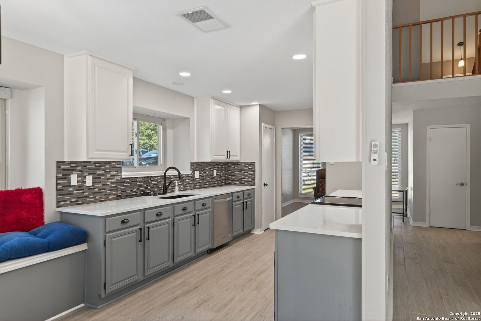 7515 Forest Edge Live Oak, TX 78233 - Photo 9 of 30 a kitchen with stainless steel appliances kitchen island granite countertop a sink and cabinets