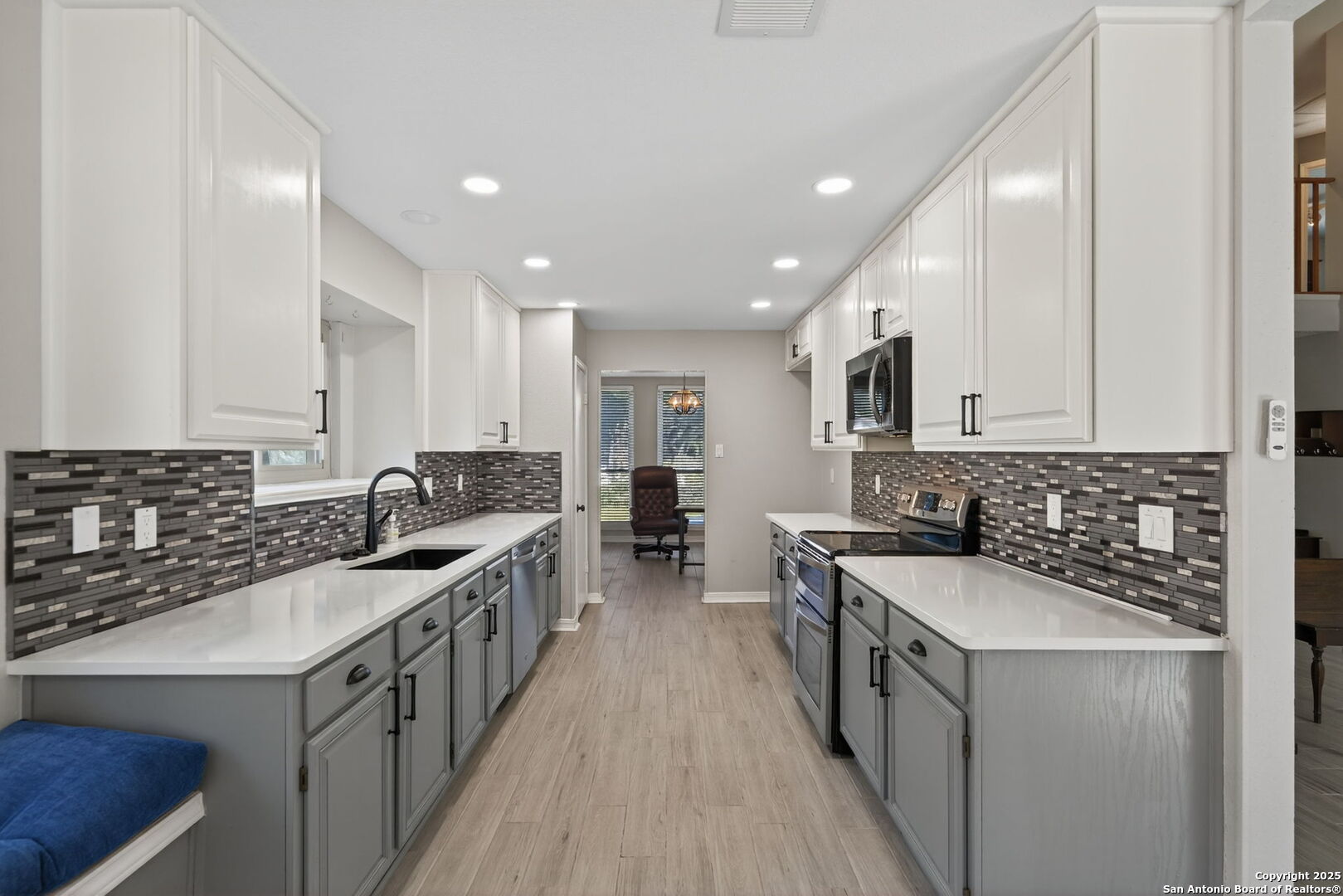 7515 Forest Edge Live Oak, TX 78233 - Photo 10 of 30 a kitchen with a sink stove top oven and cabinets
