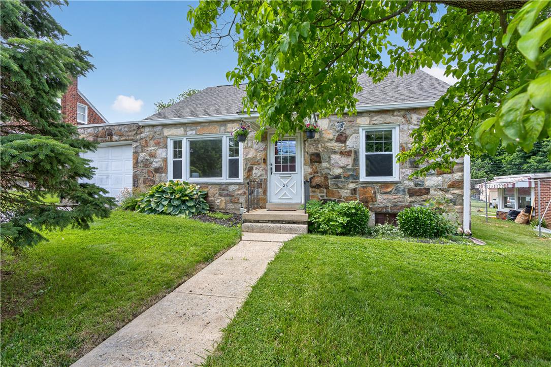 23 Harrison Street Emmaus, PA 18049 - Photo 3 of 28 A charming stone facade with a well-maintained lawn welcomes you to this delightful home.