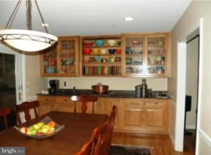 1934 Ruxton Road Towson, MD 21204 - Photo 3 of 8 a kitchen with a table and chairs in it
