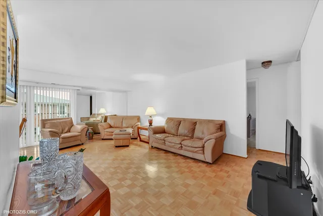 a living room with furniture window and a flat screen tv