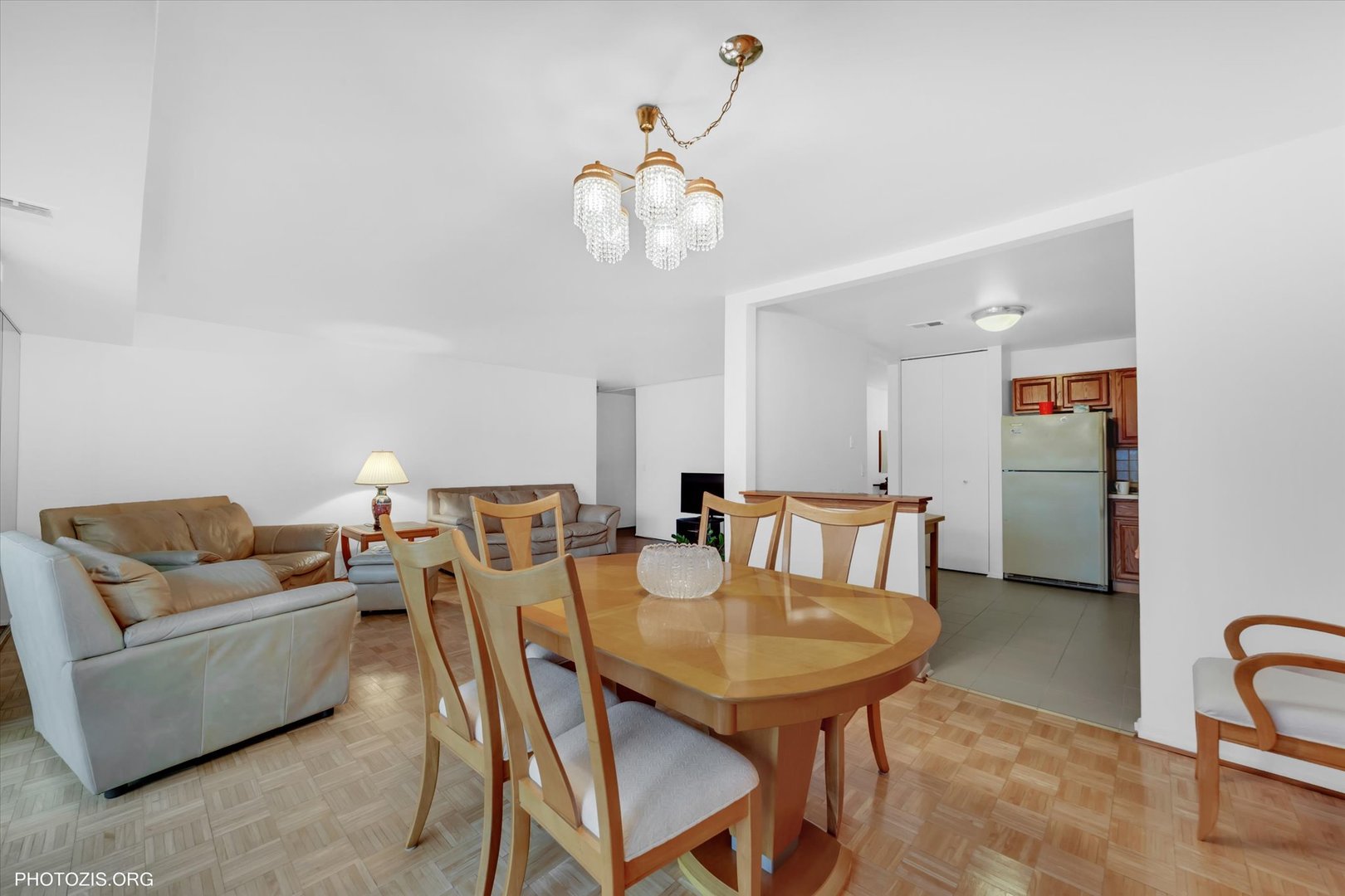 4838 West Howard Street, Unit 301 Skokie, IL 60077 - Photo 15 of 32 a view of a dining room with furniture and a chandelier