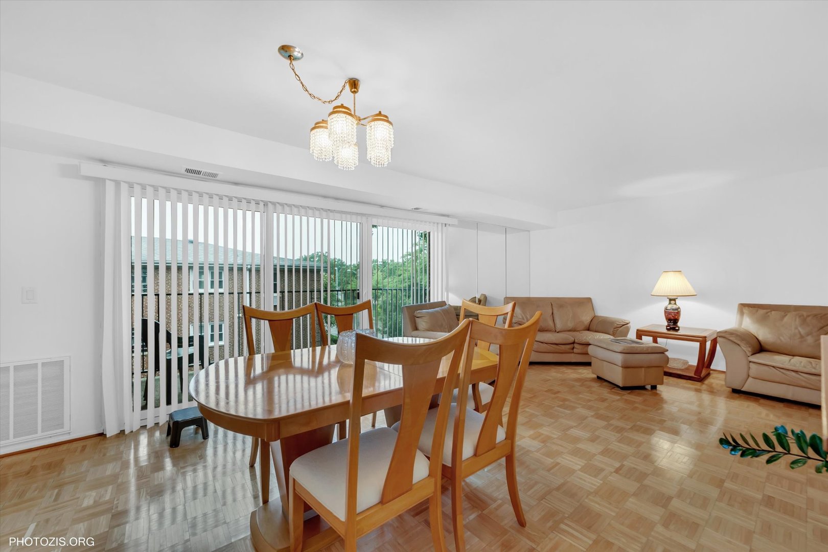4838 West Howard Street, Unit 301 Skokie, IL 60077 - Photo 16 of 32 a view of a dining room with furniture window and wooden floor