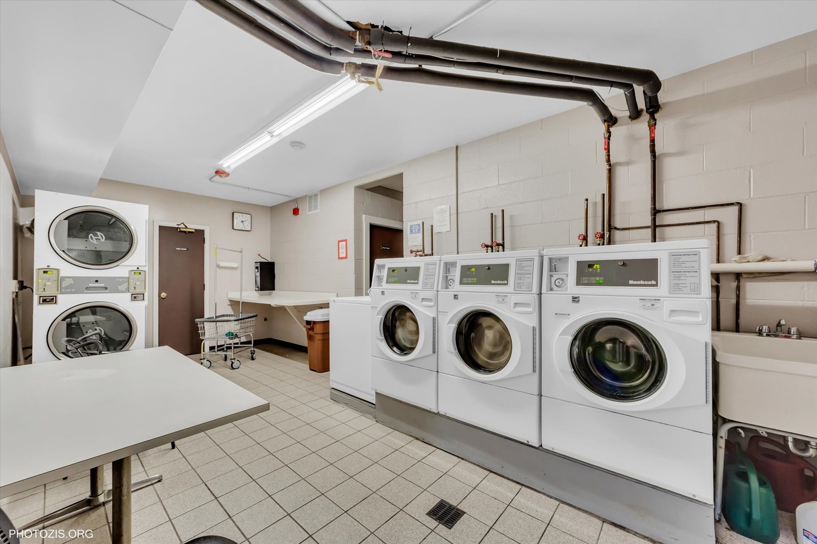 4838 West Howard Street, Unit 301 Skokie, IL 60077 - Photo 29 of 32 a utility room with dryer and washer