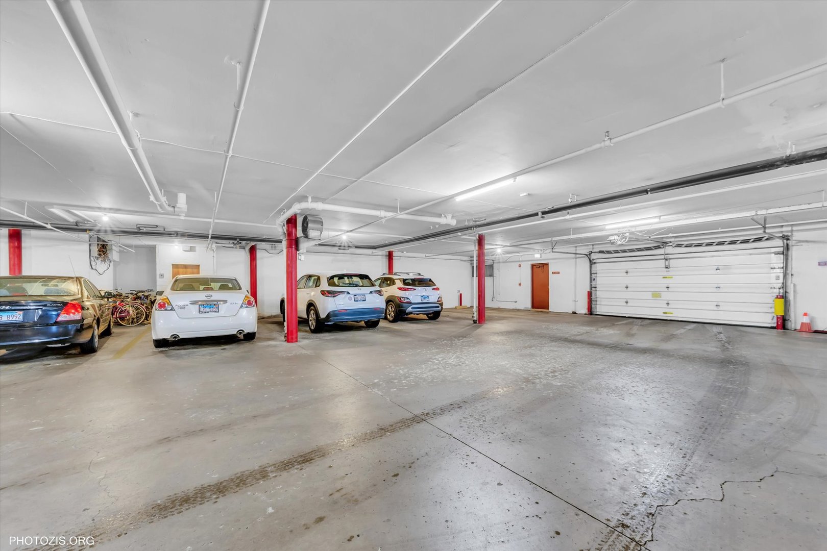 4838 West Howard Street, Unit 301 Skokie, IL 60077 - Photo 30 of 32 a view of cars parked in a parking