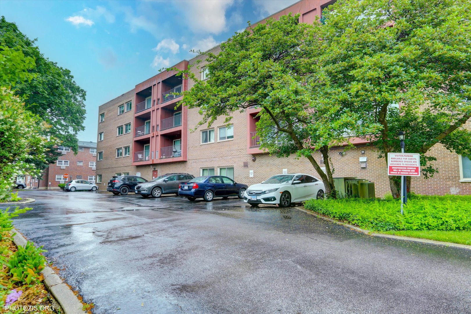 4838 West Howard Street, Unit 301 Skokie, IL 60077 - Photo 31 of 32 a view of a street with potted plants and a building