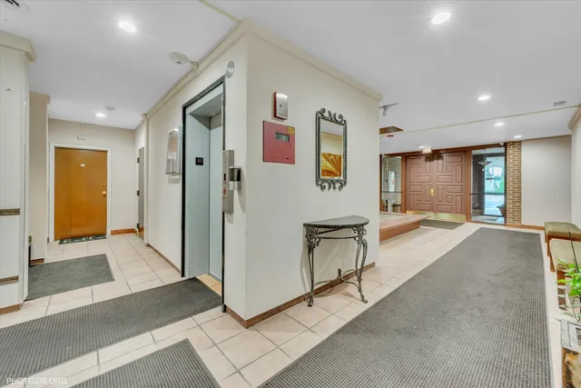 a view of a hallway with bathroom