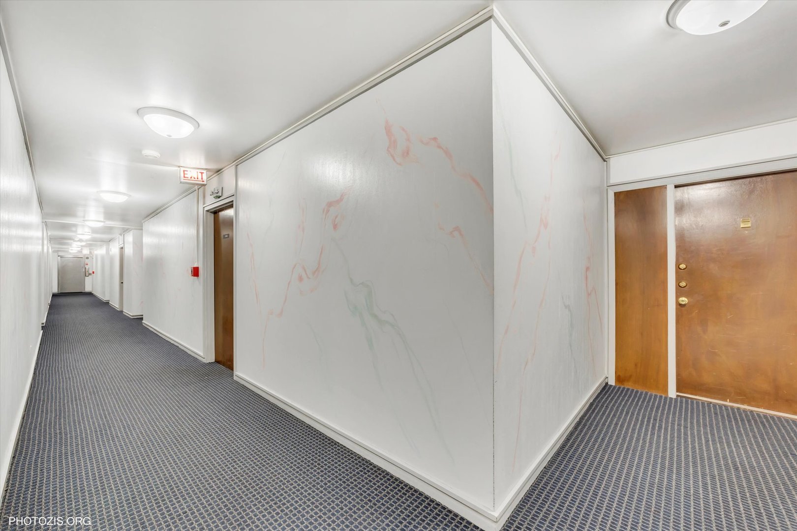 4838 West Howard Street, Unit 301 Skokie, IL 60077 - Photo 7 of 32 a view of a hallway with wooden floor
