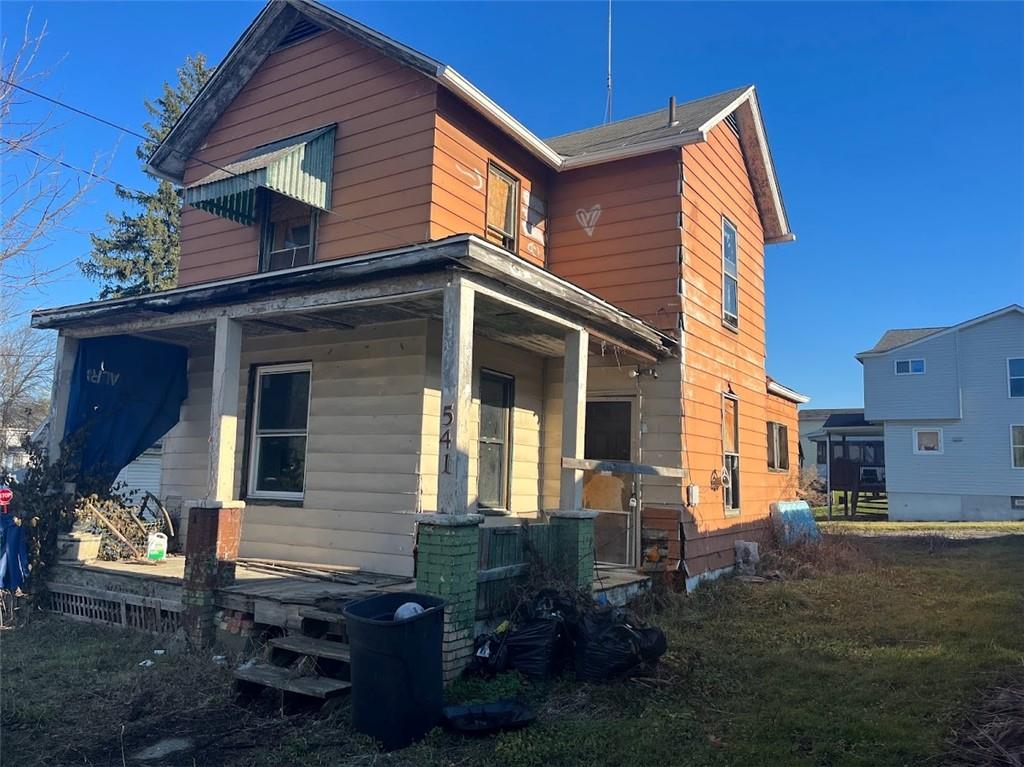541 Harmony Avenue Rochester, PA 15074 - Photo 2 of 10 a backyard of a house with wooden fence and large windows