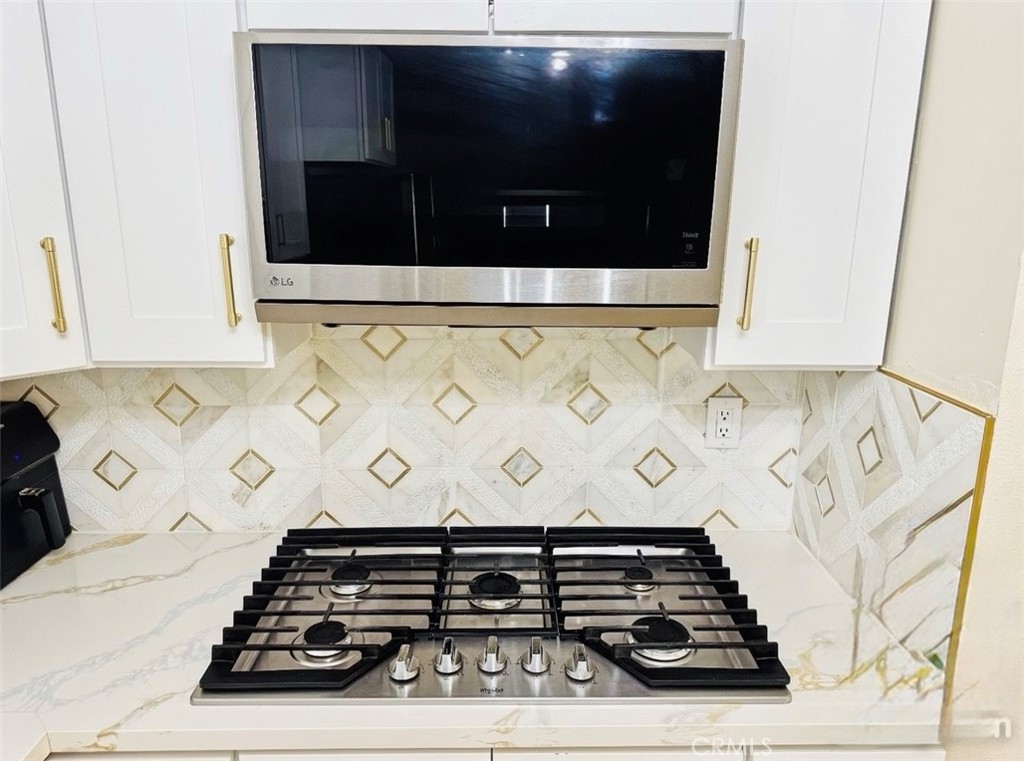 8735 Calaveras Avenue Rancho Cucamonga, CA 91730 - Photo 15 of 52 a close view of stove