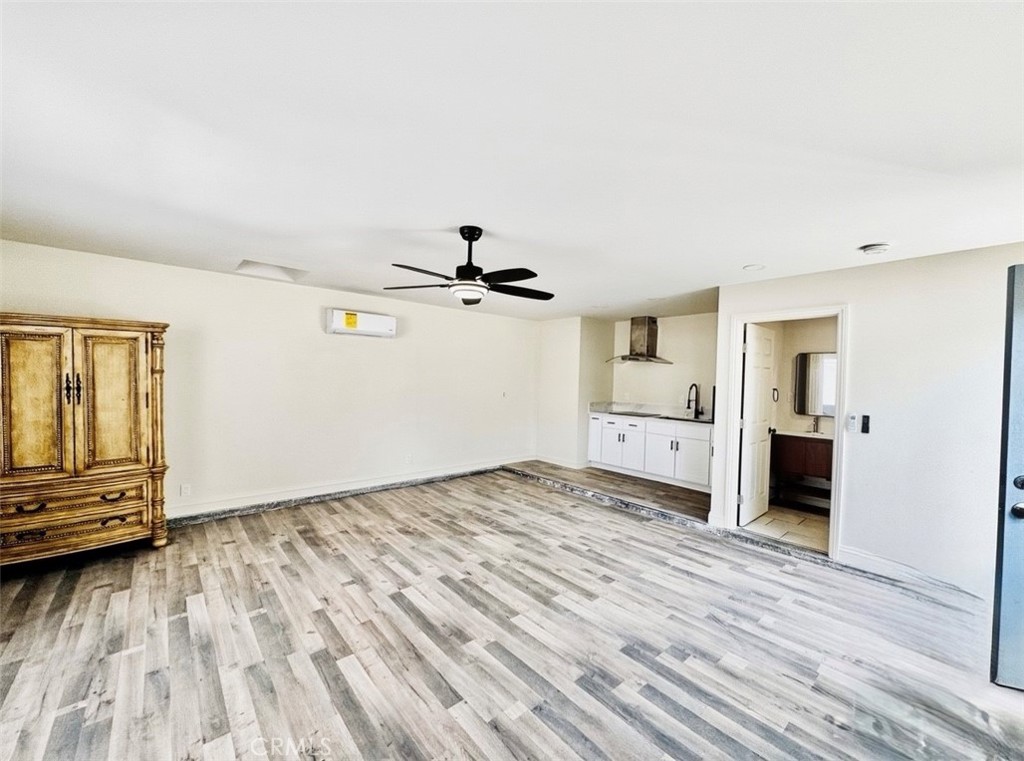 8735 Calaveras Avenue Rancho Cucamonga, CA 91730 - Photo 30 of 52 a view of empty room with wooden floor