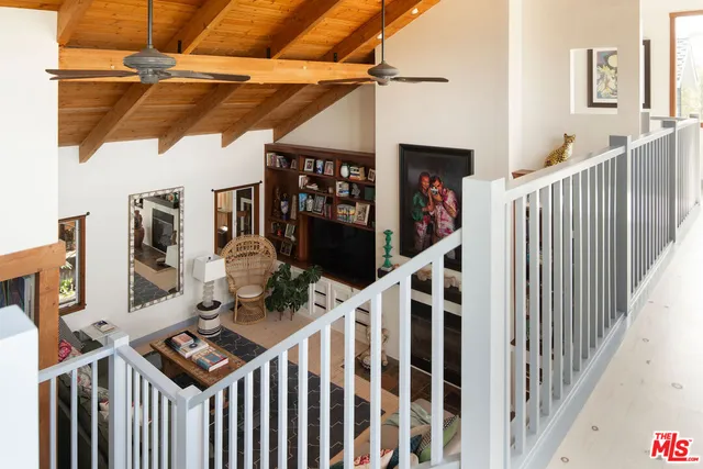 a view of a balcony with chairs
