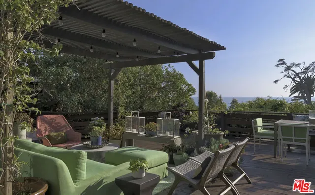 a patio with patio a table and chairs