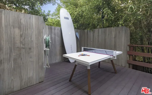 deck with table and chairs in wooden floor