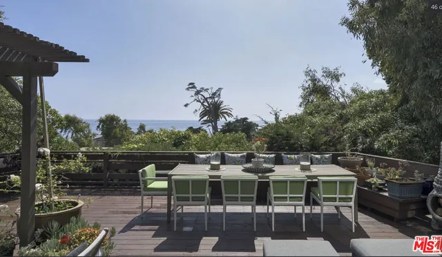 a view of a terrace with furniture
