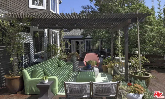 a view of a chairs and table in patio