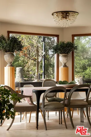 a view of a dining room with furniture window and outside view