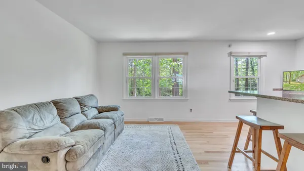 a living room with furniture and window