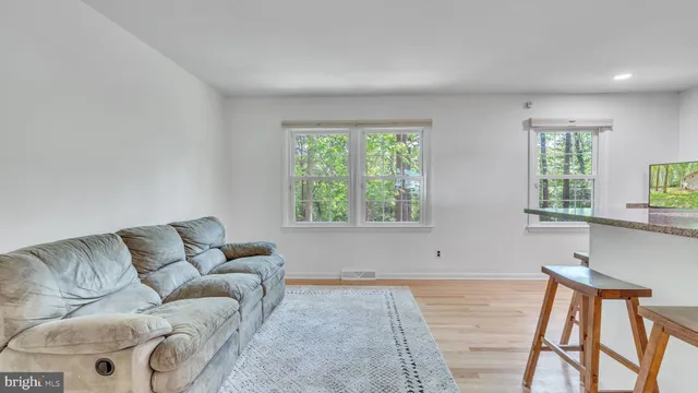 a living room with furniture and window