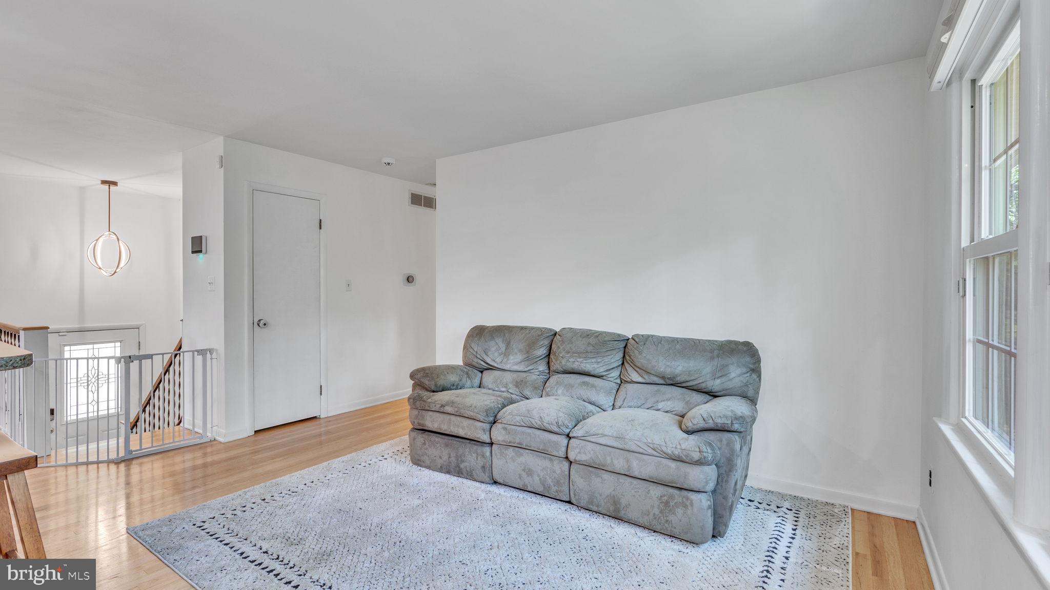24680 Morgan Road Hollywood, MD 20636 - Photo 13 of 34 a living room with furniture and a rug