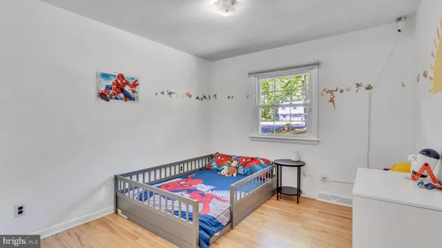 a bedroom with furniture and a window
