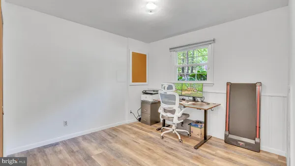 a workspace with furniture and a window
