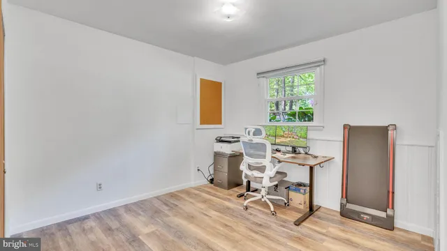 a workspace with furniture and a window